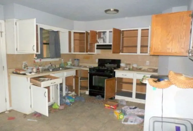 a kitchen with a stove a sink and a refrigerator