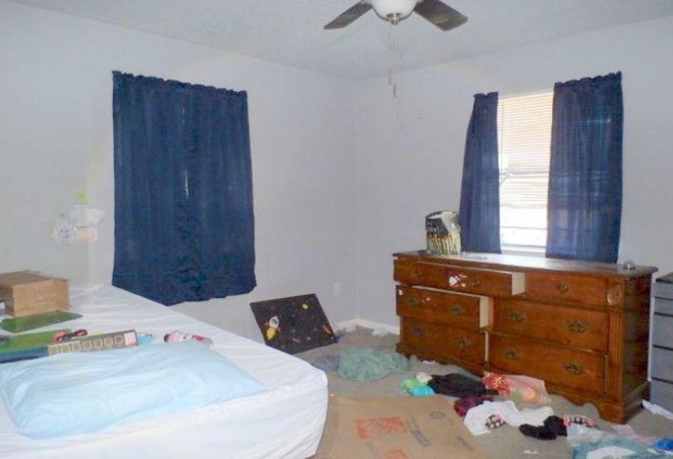 707 First Street Bangs, TX 76823 - Photo 7 of 9 a bed room with a bed and a window