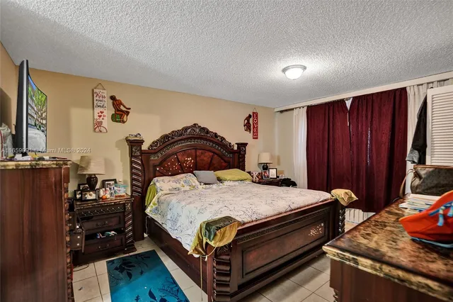 a bedroom with a bed and a closet