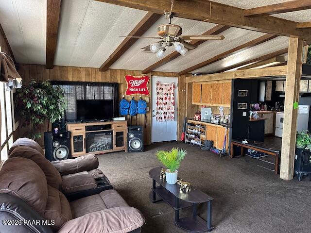 2715 West Annie Road Paulden, AZ 86334 - Photo 3 of 10 a living room with furniture a flat screen tv and gym equipment
