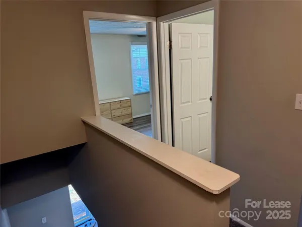 a view of a bathroom from a hallway