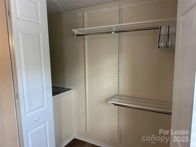 a view of room with window and ceiling fan