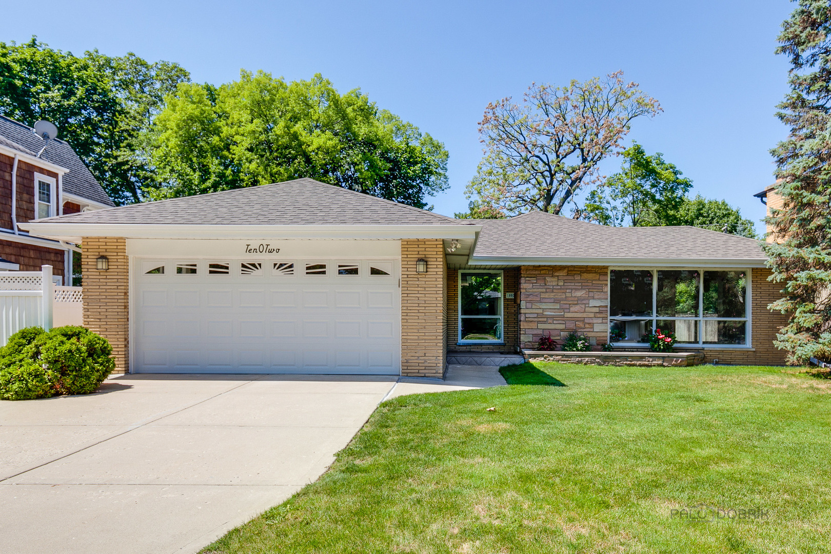 1002 Warrington Road Deerfield, IL 60015 - Photo 1 of 1 a front view of a house with a yard and trees
