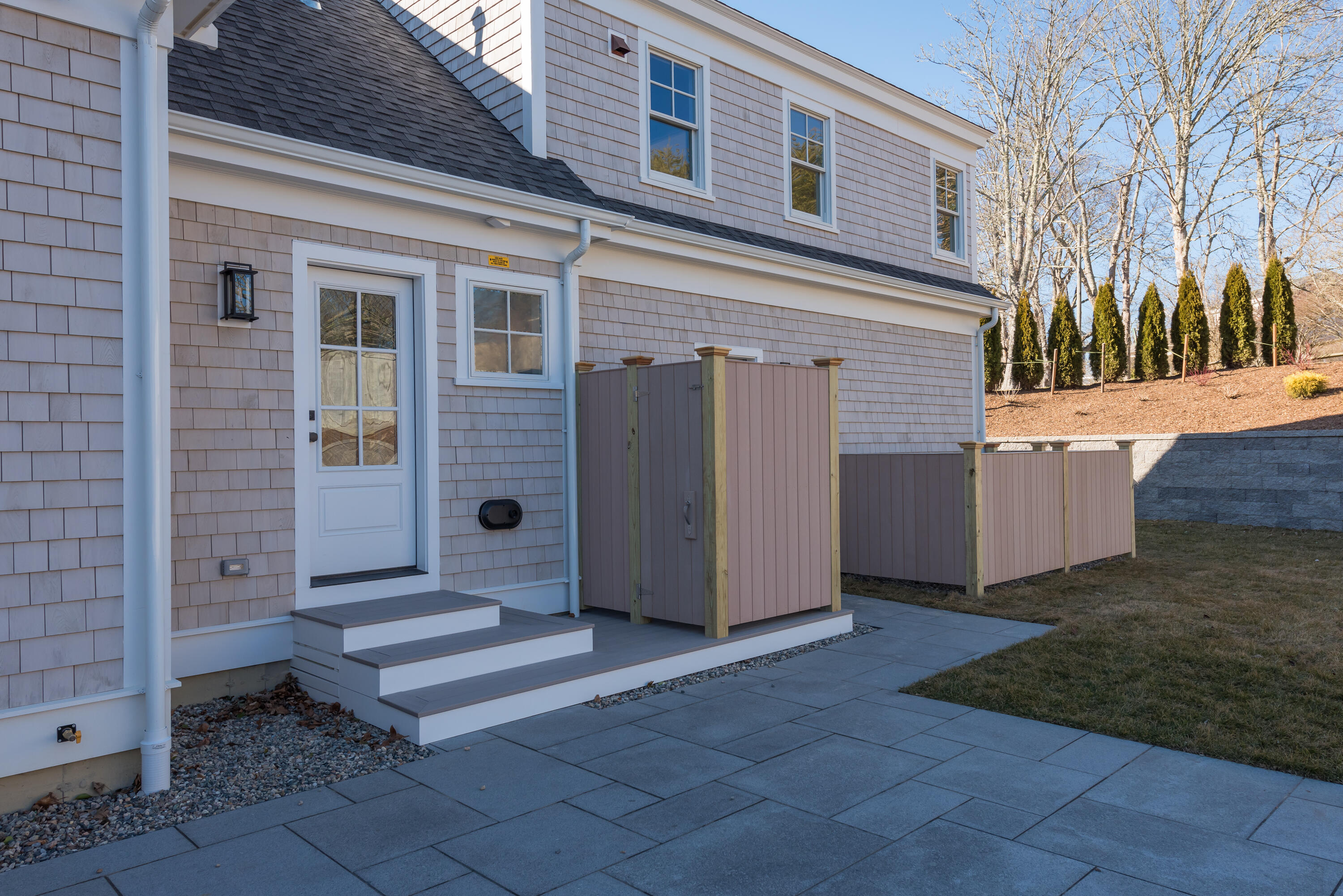 84 Doane Road Chatham, MA 02633 - Photo 6 of 11 a view of a house with a door and a yard