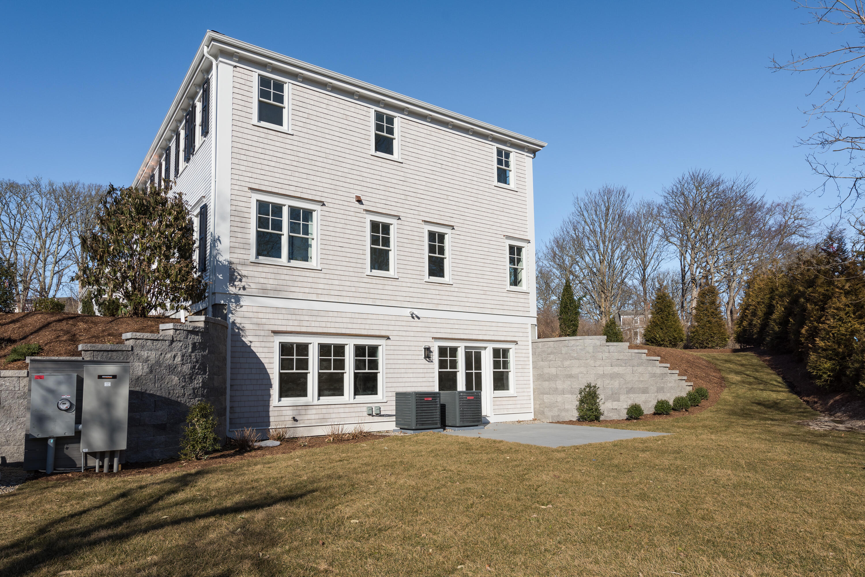84 Doane Road Chatham, MA 02633 - Photo 7 of 11 a front view of a house with a yard