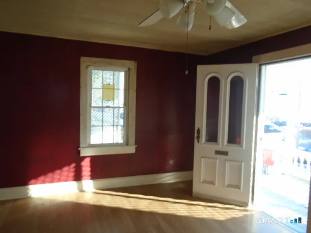 a view of a hallway with closet and bathroom