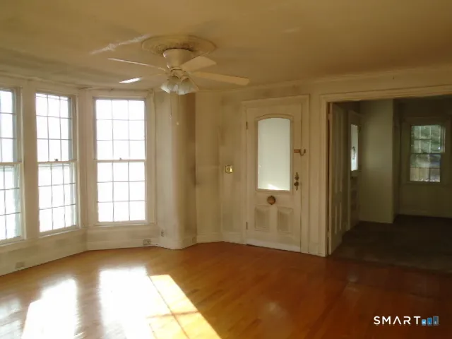 a view of an empty room with a window