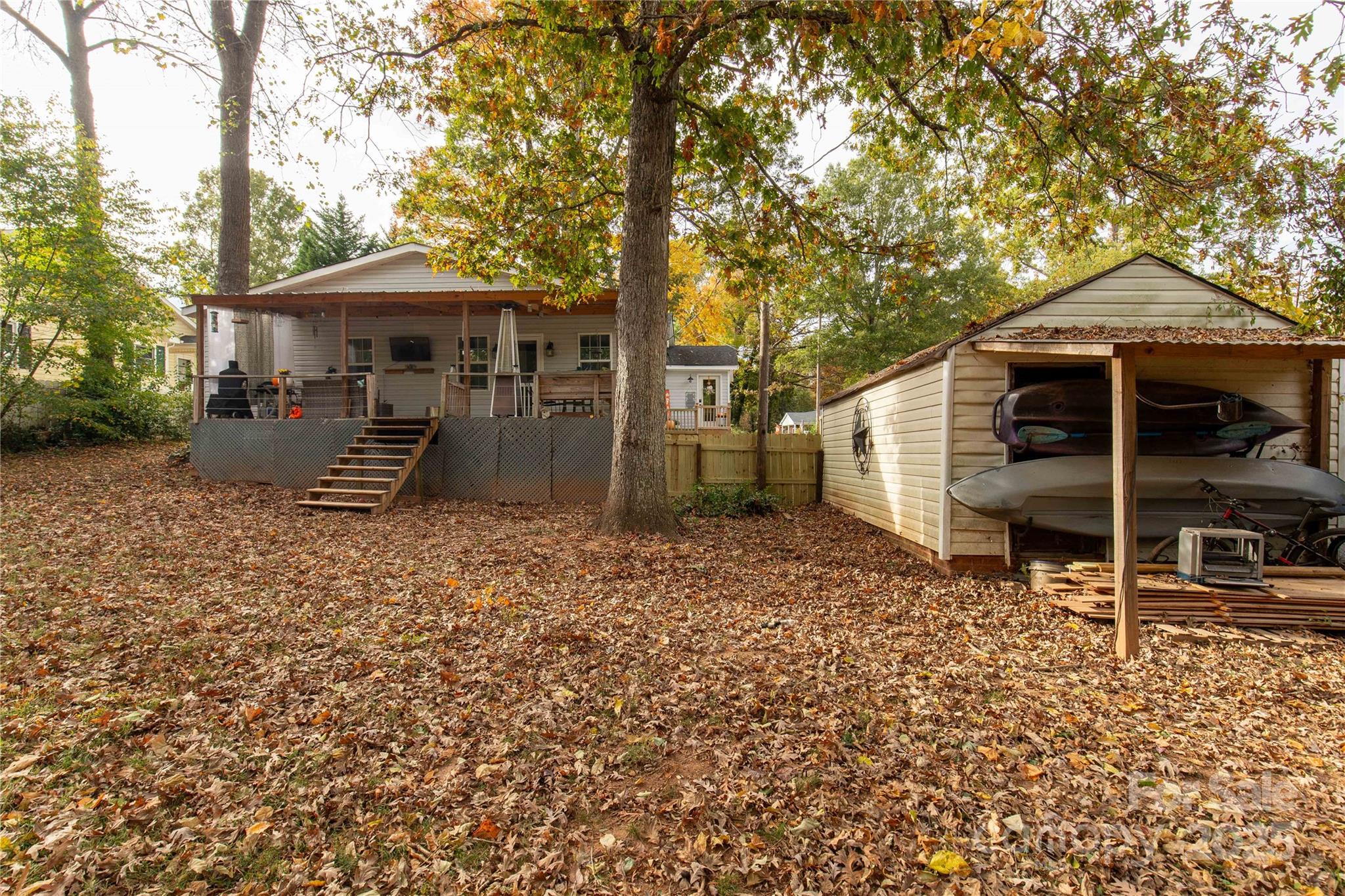 602 Unity Street Fort Mill, SC 29715 - Photo 15 of 48 a backyard of a house with barbeque oven table and chairs