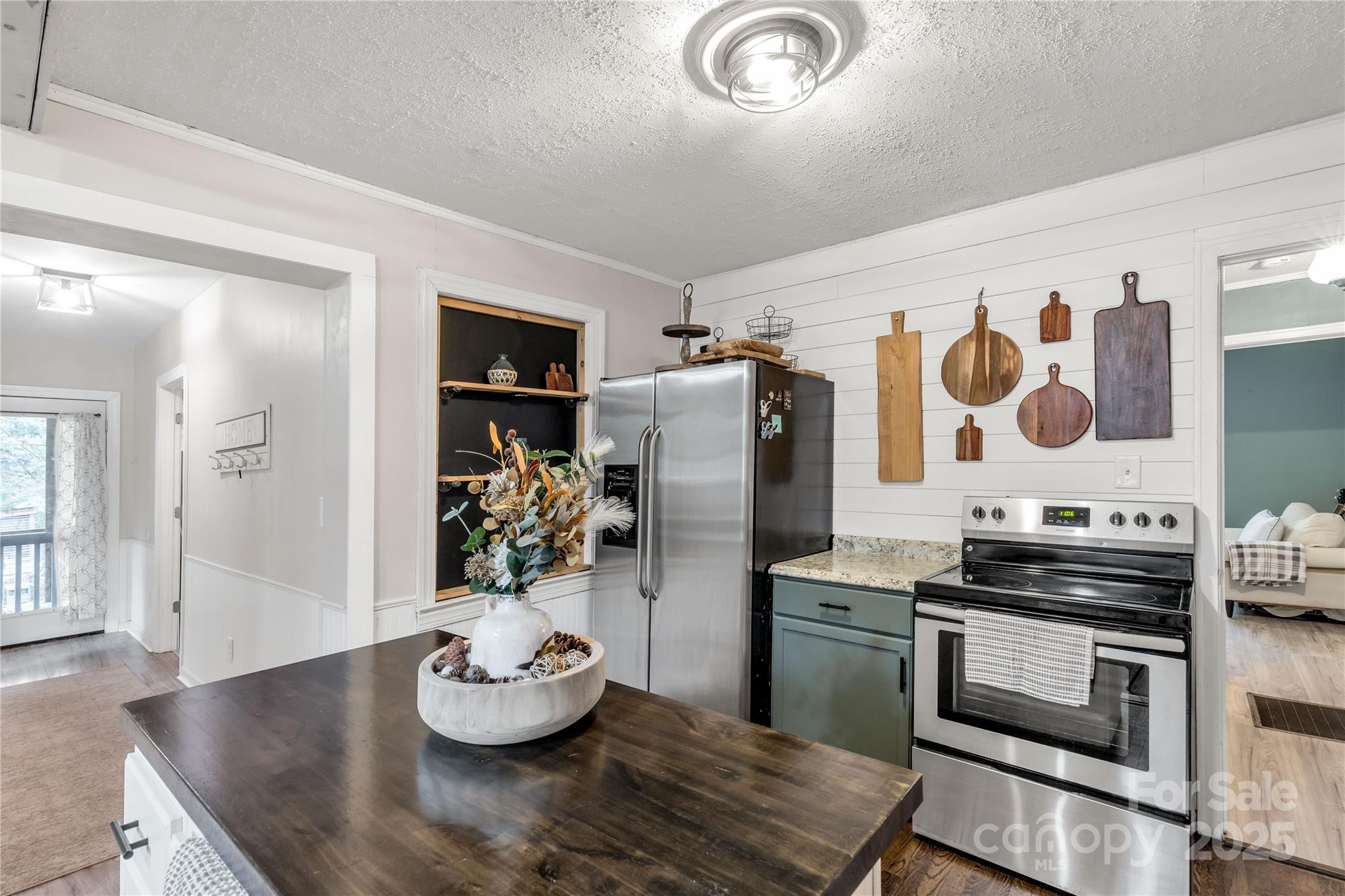 602 Unity Street Fort Mill, SC 29715 - Photo 31 of 48 a kitchen with stainless steel appliances kitchen island granite countertop a stove and cabinets