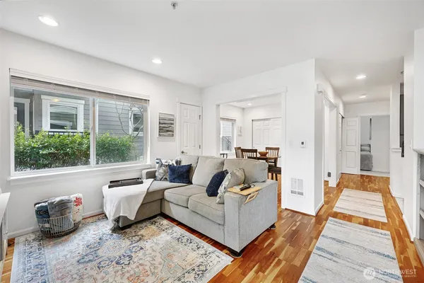 a living room with furniture and a large window