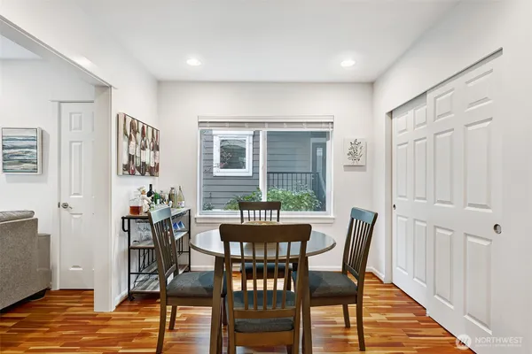 a view of a dining room with furniture window and wooden floor
