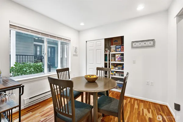 a view of a dining room with furniture and window
