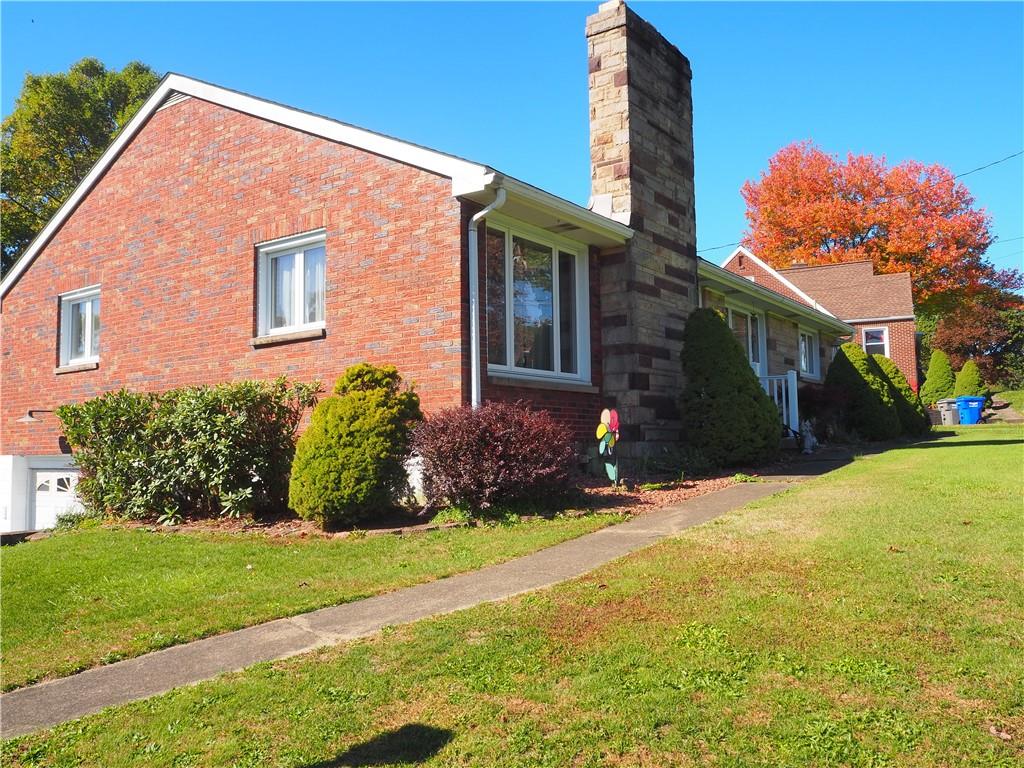 420 Saxonburg Road Butler, PA 16002 - Photo 20 of 26 a front view of a house with a yard