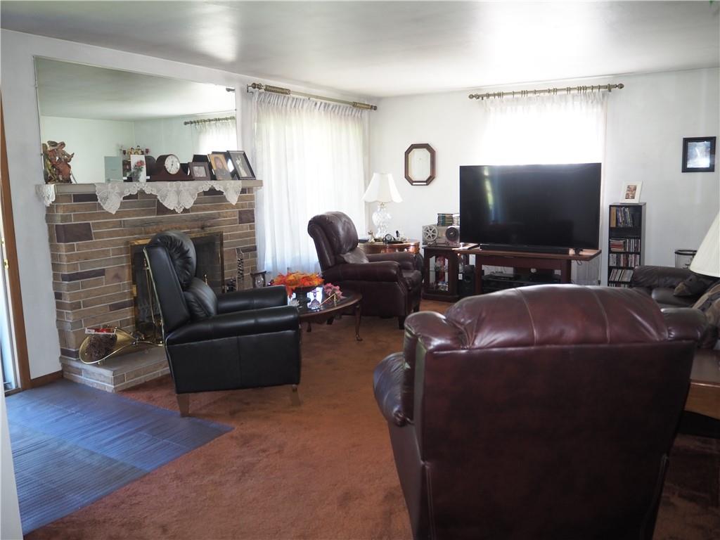 420 Saxonburg Road Butler, PA 16002 - Photo 2 of 26 a living room with furniture and a flat screen tv