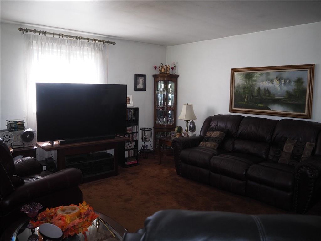 420 Saxonburg Road Butler, PA 16002 - Photo 5 of 26 a living room with furniture and a flat screen tv