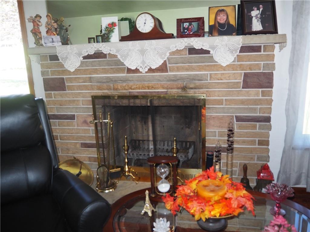 420 Saxonburg Road Butler, PA 16002 - Photo 6 of 26 a room with fireplace and table