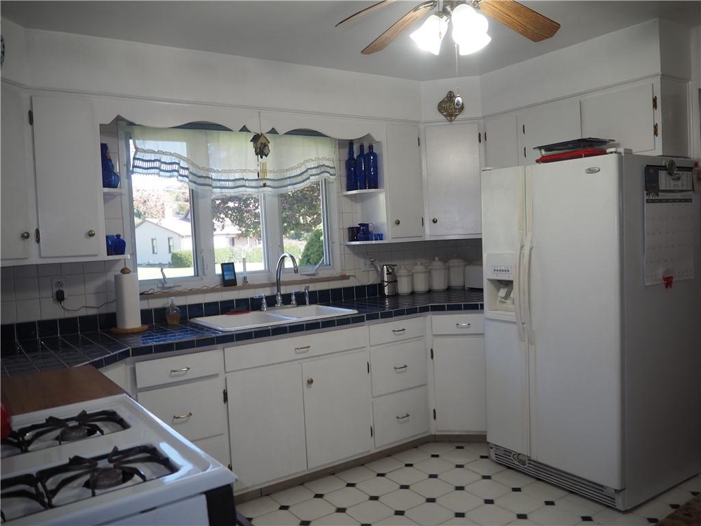 420 Saxonburg Road Butler, PA 16002 - Photo 10 of 26 a kitchen with sink cabinets and window