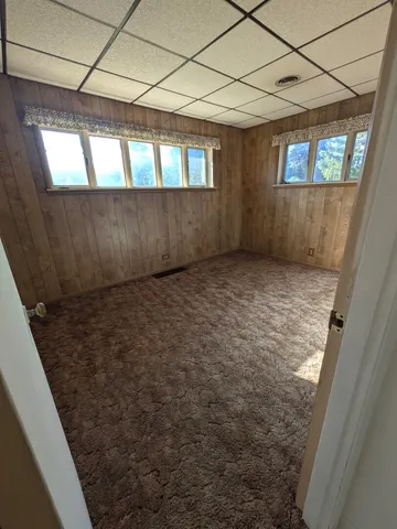 a view of an empty room with windows