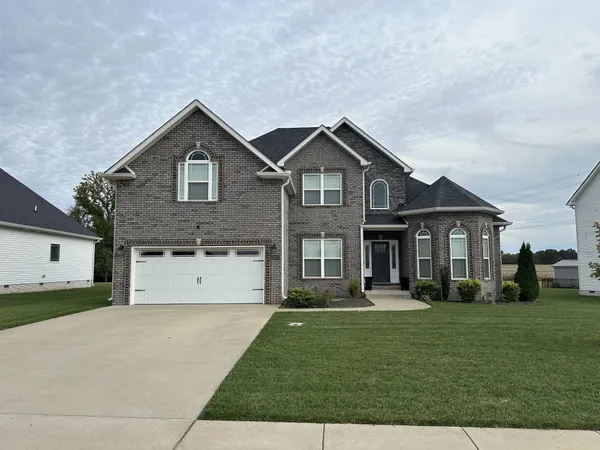 a front view of a house with a yard