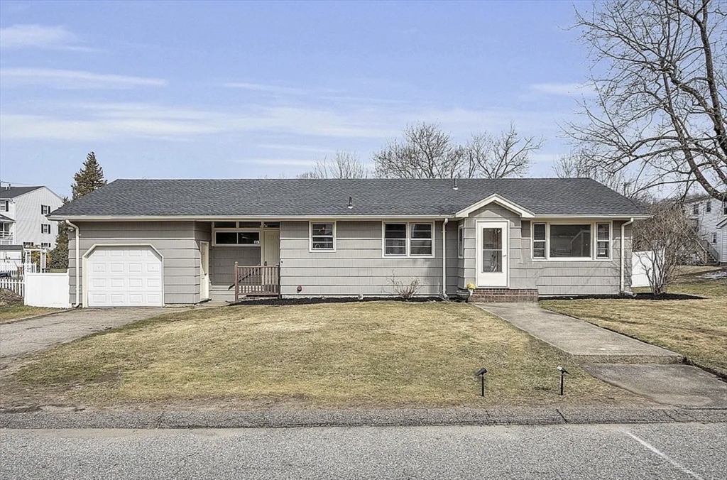 9 Alpha Street Haverhill, MA 01832 - Photo 1 of 14 a front view of a house with a yard