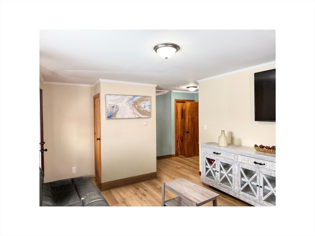 9 Alpha Street Haverhill, MA 01832 - Photo 4 of 14 a living room with furniture and flat screen tv