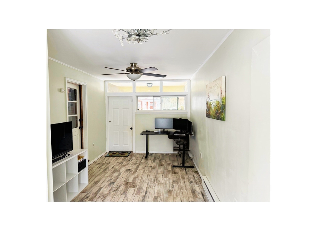 9 Alpha Street Haverhill, MA 01832 - Photo 6 of 14 a living room with furniture and a flat screen tv