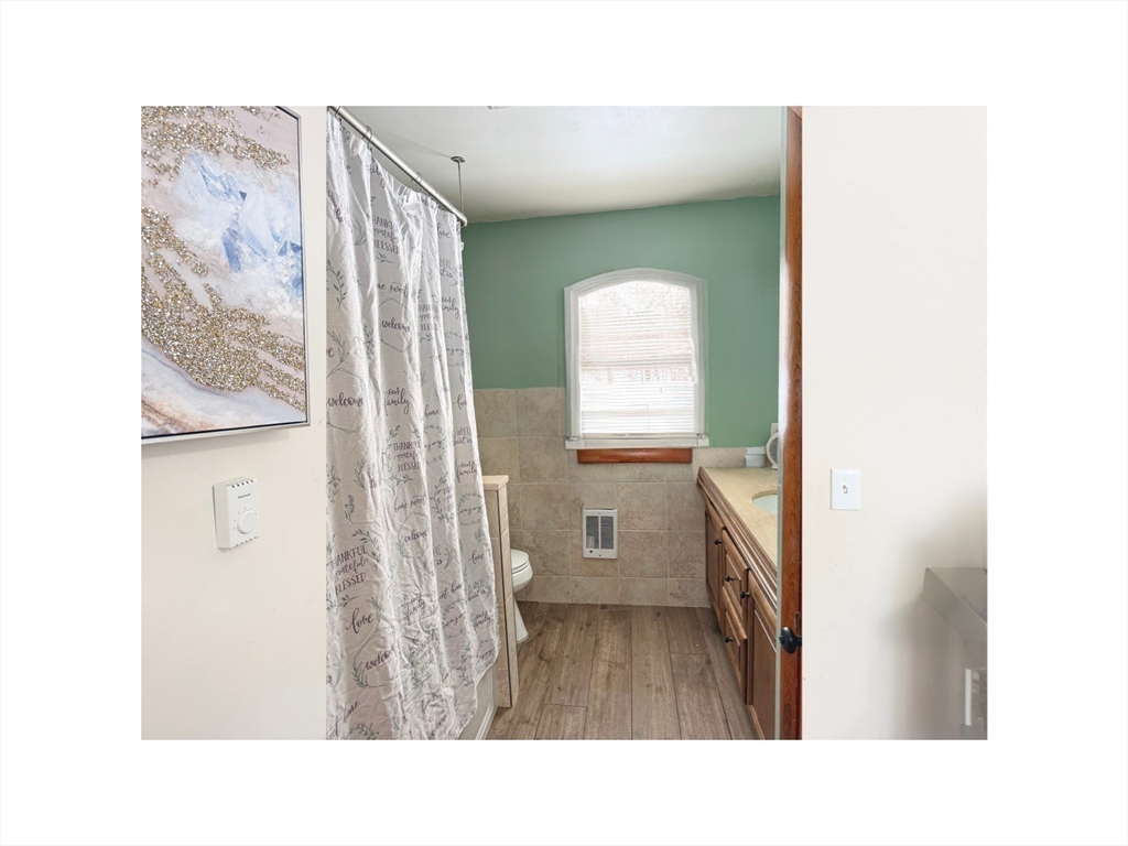 9 Alpha Street Haverhill, MA 01832 - Photo 8 of 14 a open space with a window and a bathroom