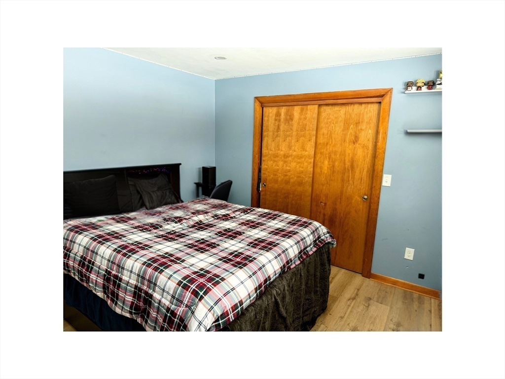 9 Alpha Street Haverhill, MA 01832 - Photo 9 of 14 a bedroom with a bed and a window