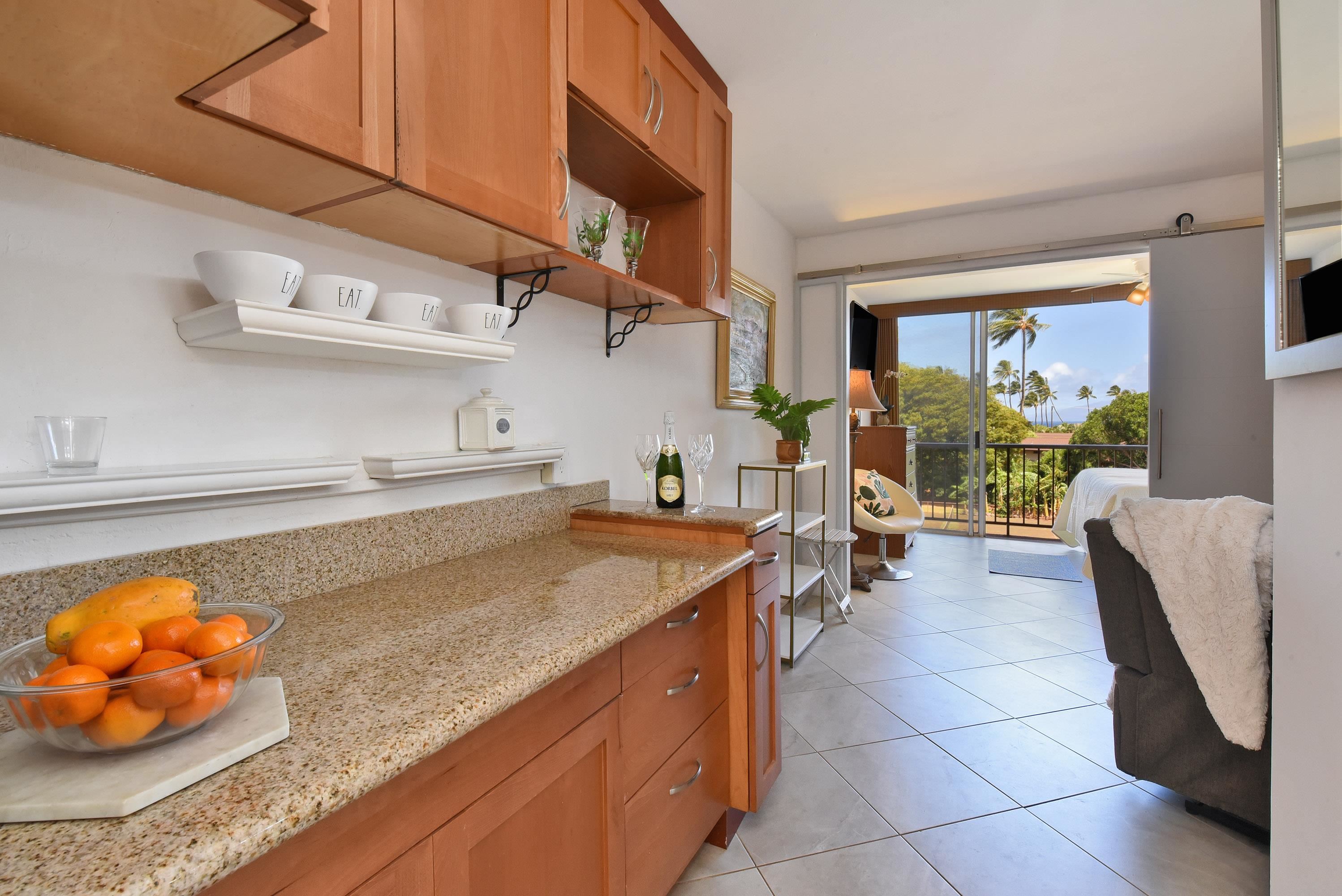 3660 Lower Honoapiilani Road, Unit 302 Lahaina, HI 96761 - Photo 13 of 27 a kitchen with a sink and cabinets