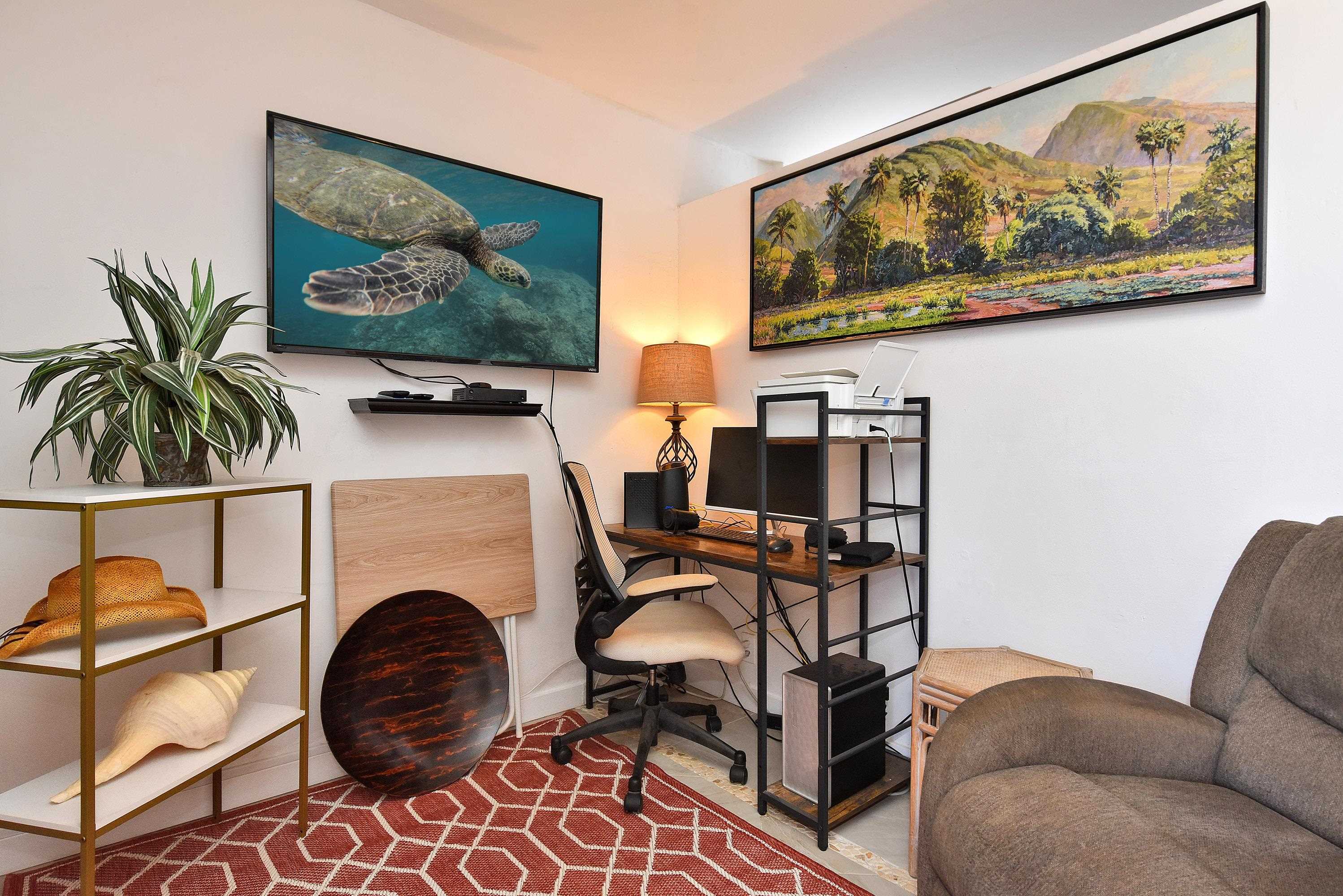 3660 Lower Honoapiilani Road, Unit 302 Lahaina, HI 96761 - Photo 18 of 27 a living room with furniture and a flat screen tv