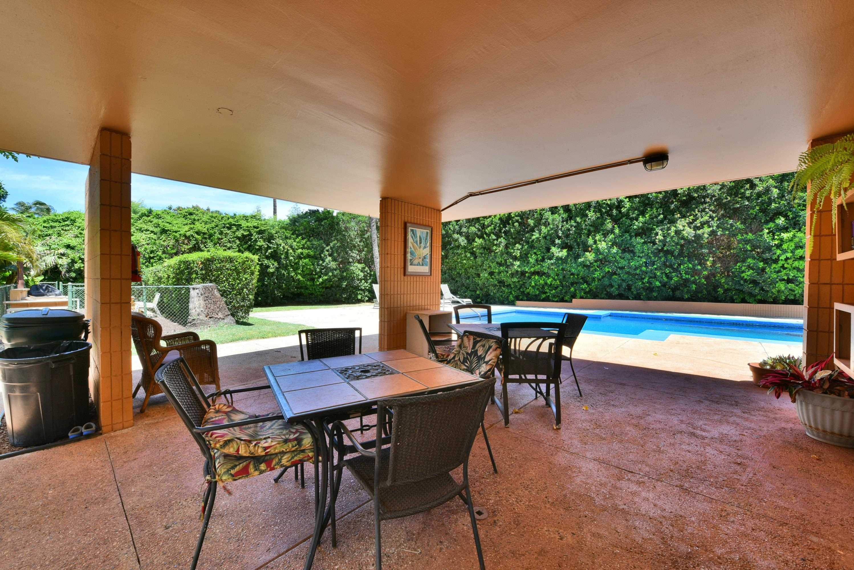 3660 Lower Honoapiilani Road, Unit 302 Lahaina, HI 96761 - Photo 19 of 27 a view of a patio with a table chairs and a table