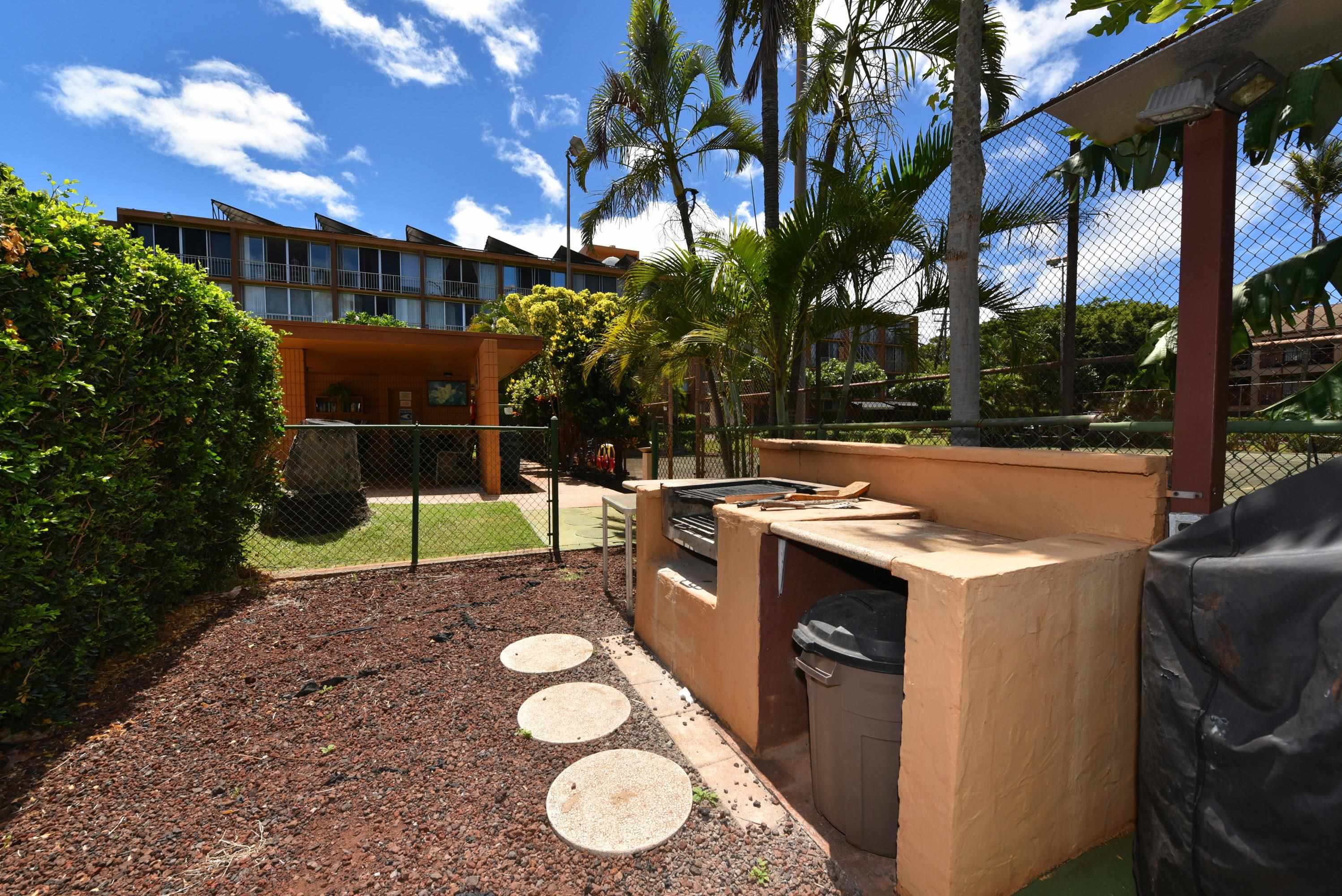 3660 Lower Honoapiilani Road, Unit 302 Lahaina, HI 96761 - Photo 23 of 27 a view of a backyard with swimming pool