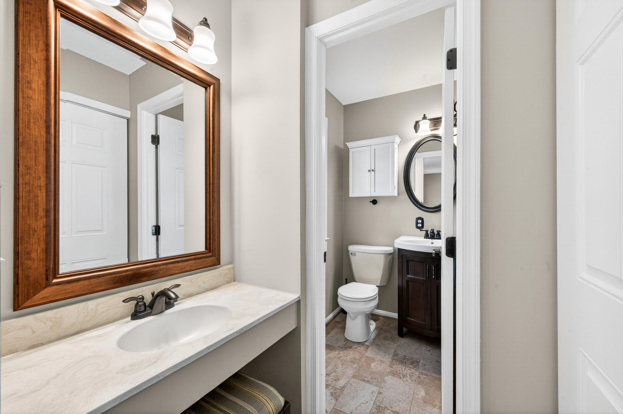 11737 Dry River Court Reston, VA 20191 - Photo 19 of 45 a bathroom with a toilet sink and mirror