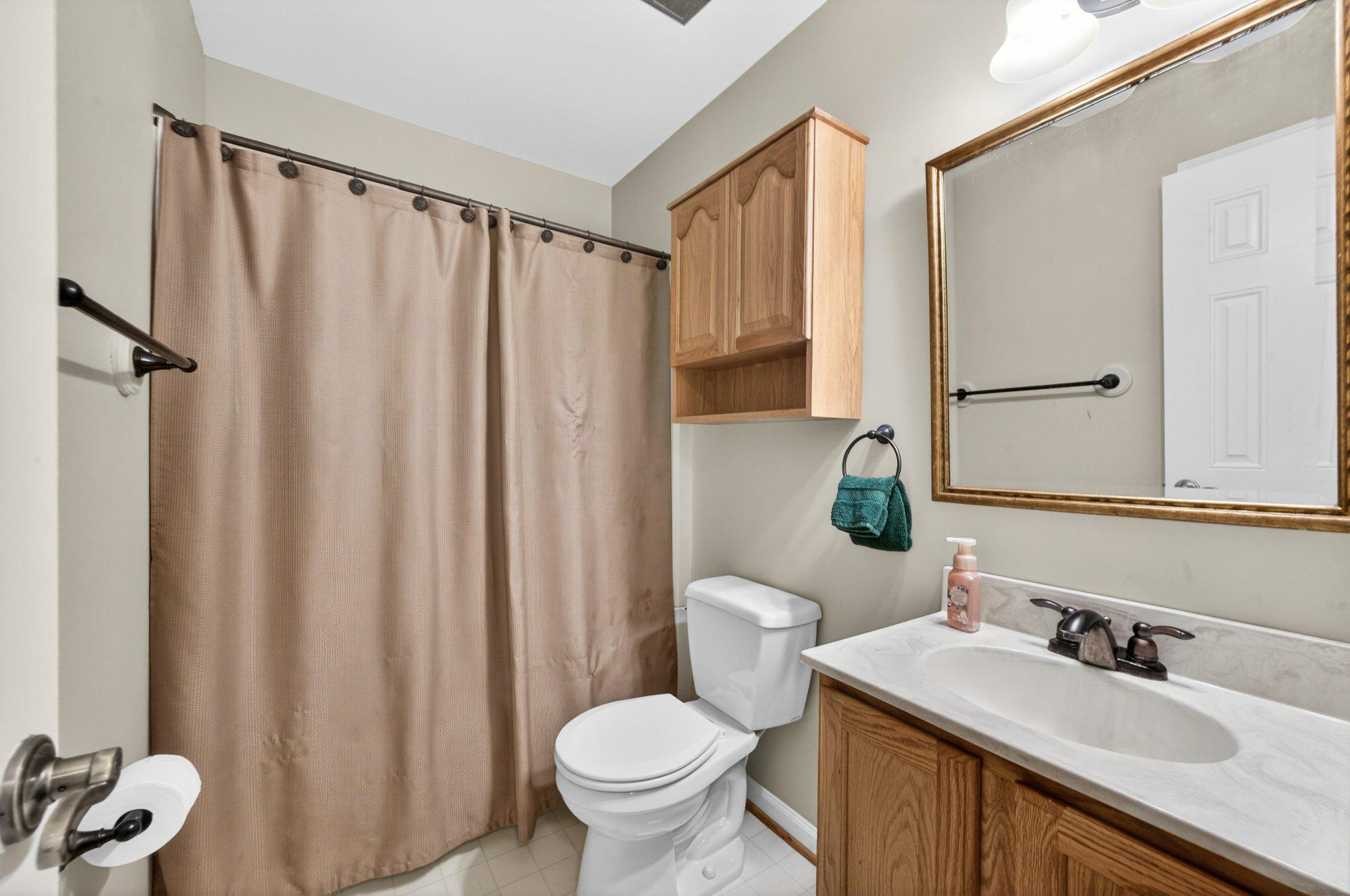 11737 Dry River Court Reston, VA 20191 - Photo 22 of 45 a bathroom with a granite countertop sink toilet and a mirror