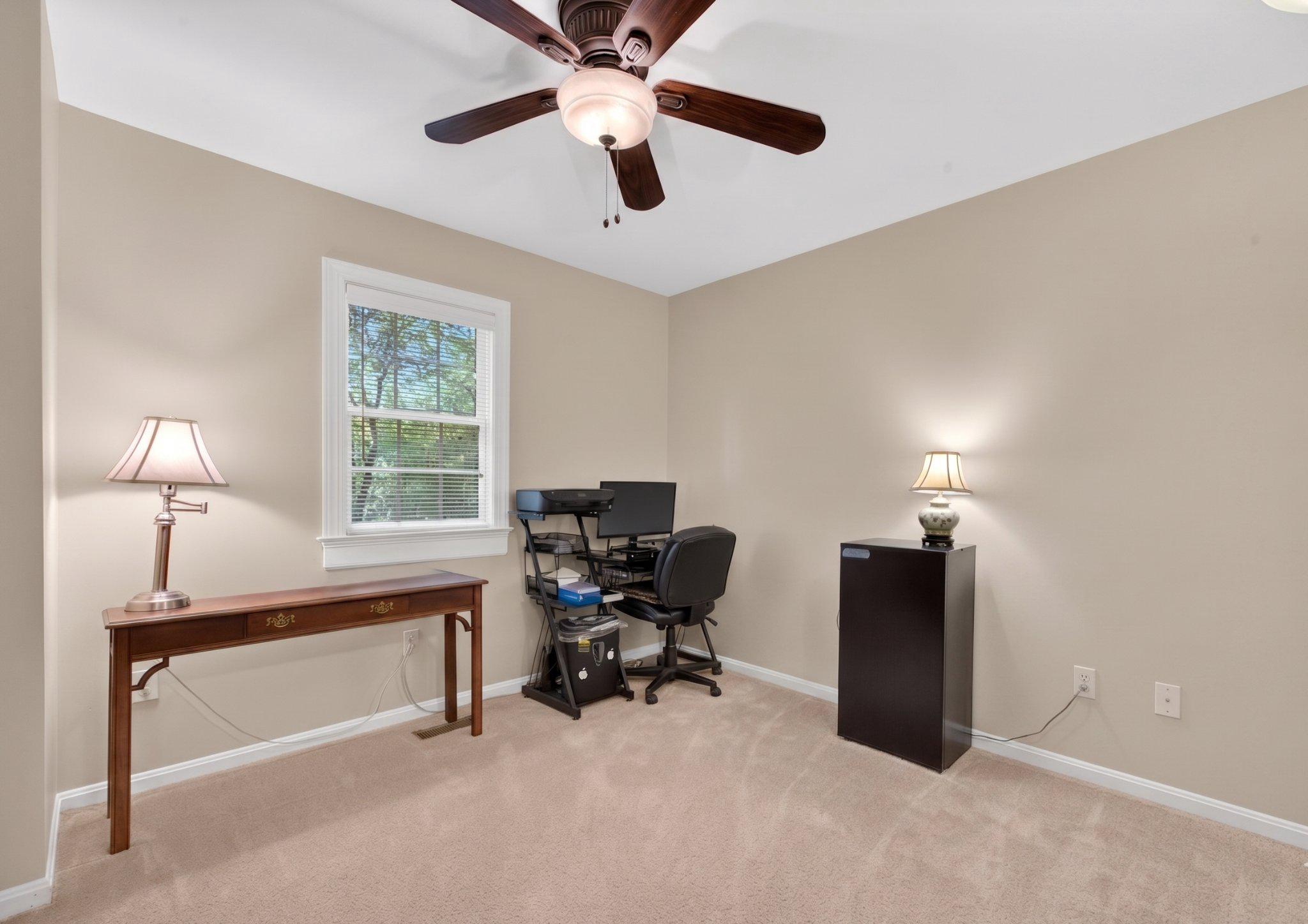 11737 Dry River Court Reston, VA 20191 - Photo 24 of 45 a view of a workspace with furniture and a window