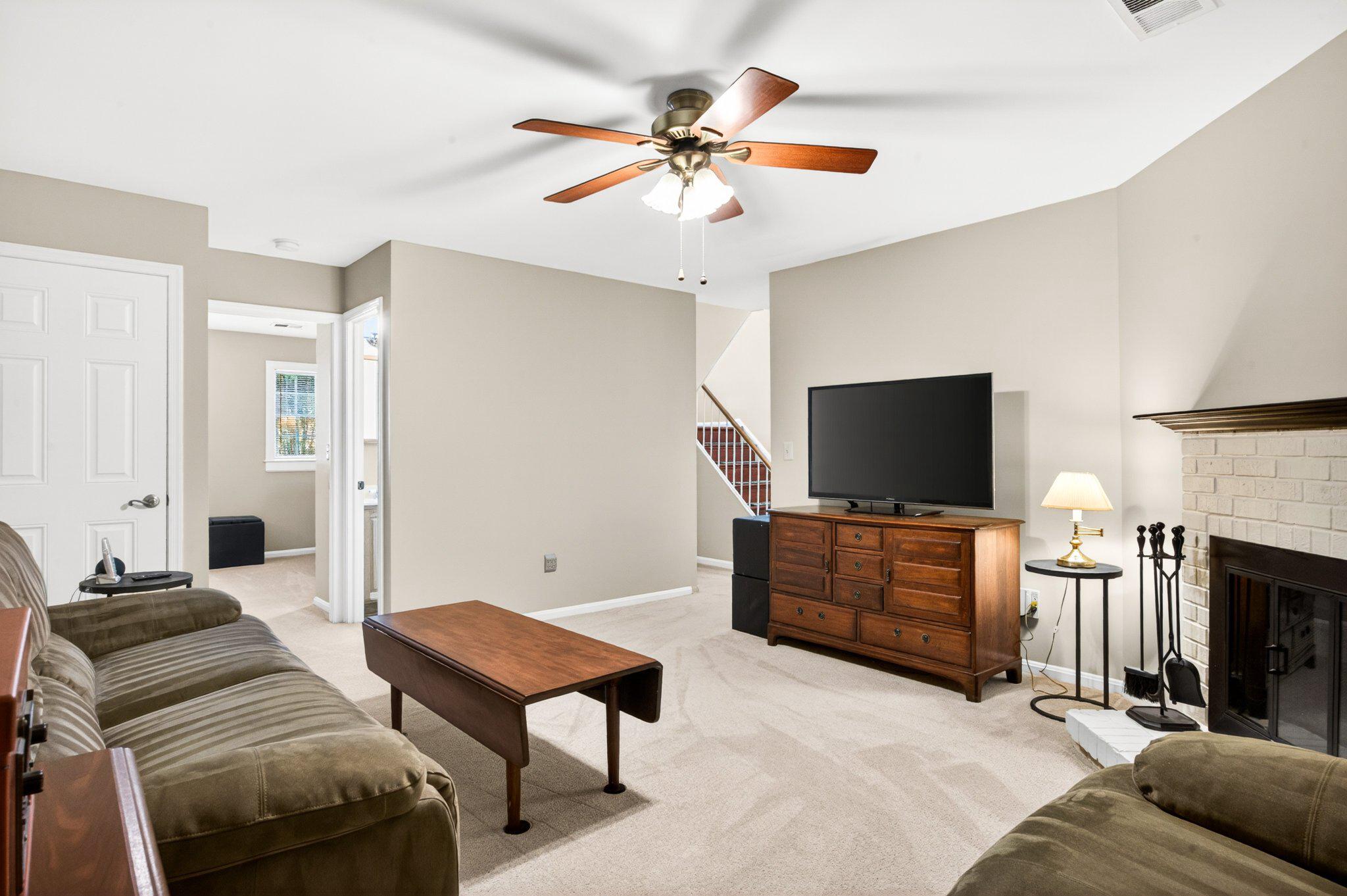 11737 Dry River Court Reston, VA 20191 - Photo 25 of 45 a living room with furniture and a flat screen tv