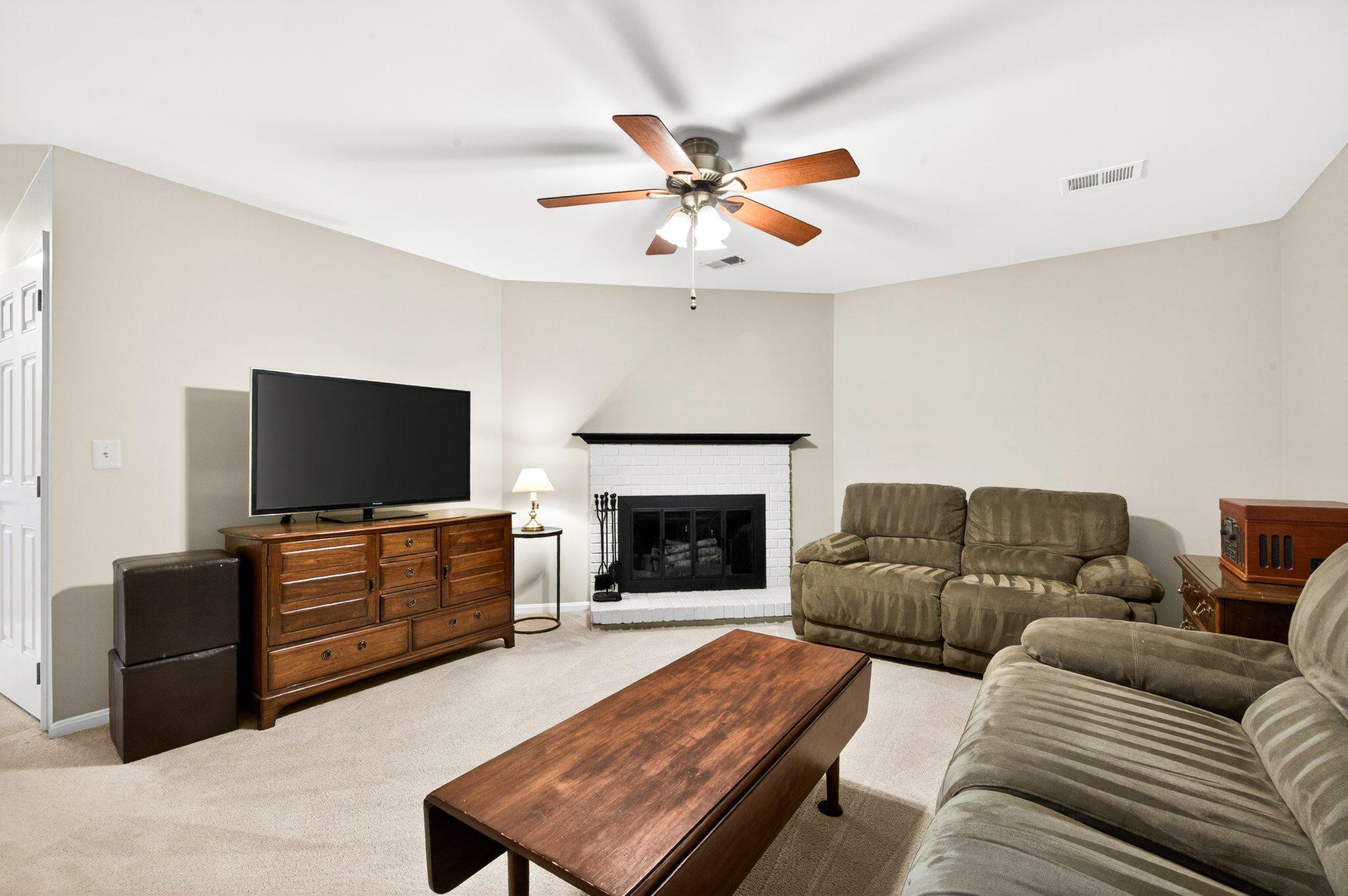 11737 Dry River Court Reston, VA 20191 - Photo 26 of 45 a living room with furniture and a fireplace