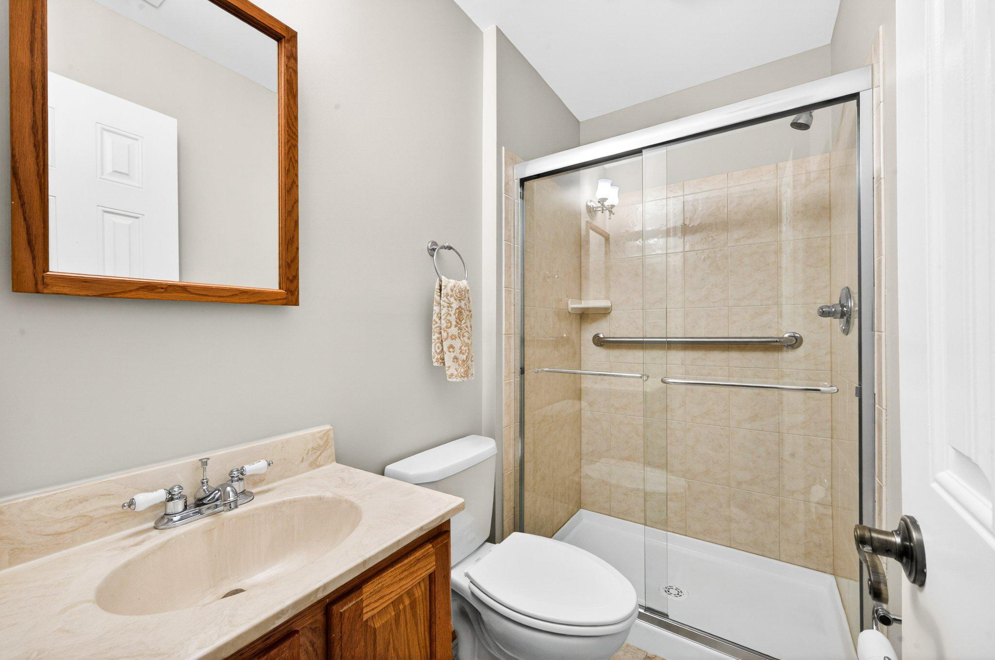 11737 Dry River Court Reston, VA 20191 - Photo 27 of 45 a bathroom with a sink mirror toilet and shower