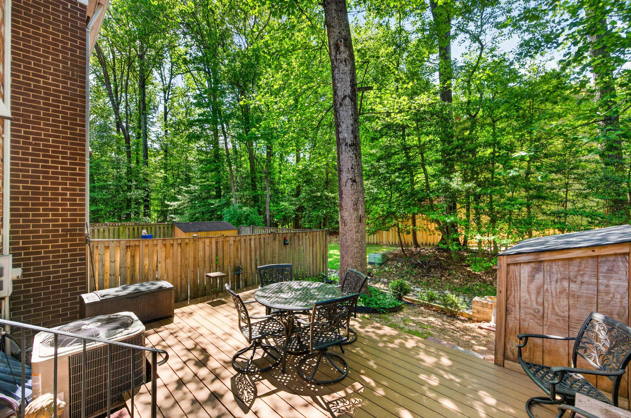 11737 Dry River Court Reston, VA 20191 - Photo 32 of 45 a view of a table and chairs in back yard of the house
