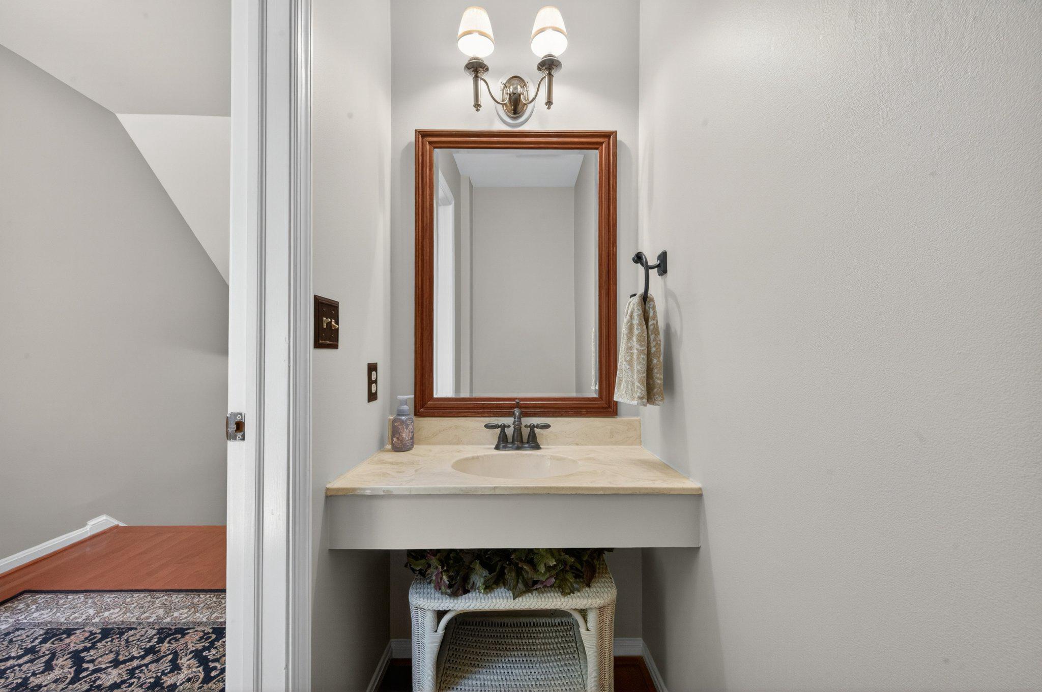 11737 Dry River Court Reston, VA 20191 - Photo 35 of 45 a bathroom with a sink and a mirror
