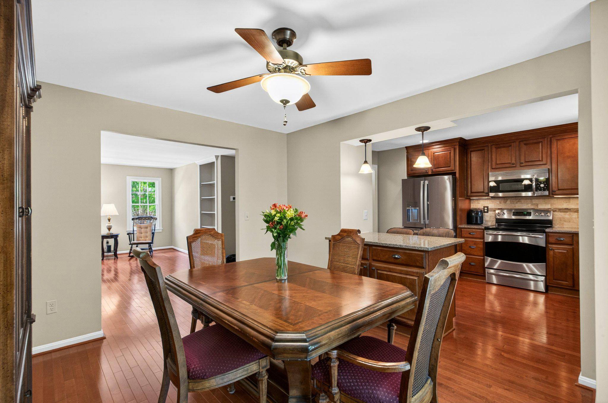 11737 Dry River Court Reston, VA 20191 - Photo 8 of 45 a dining room with furniture a window and wooden floor