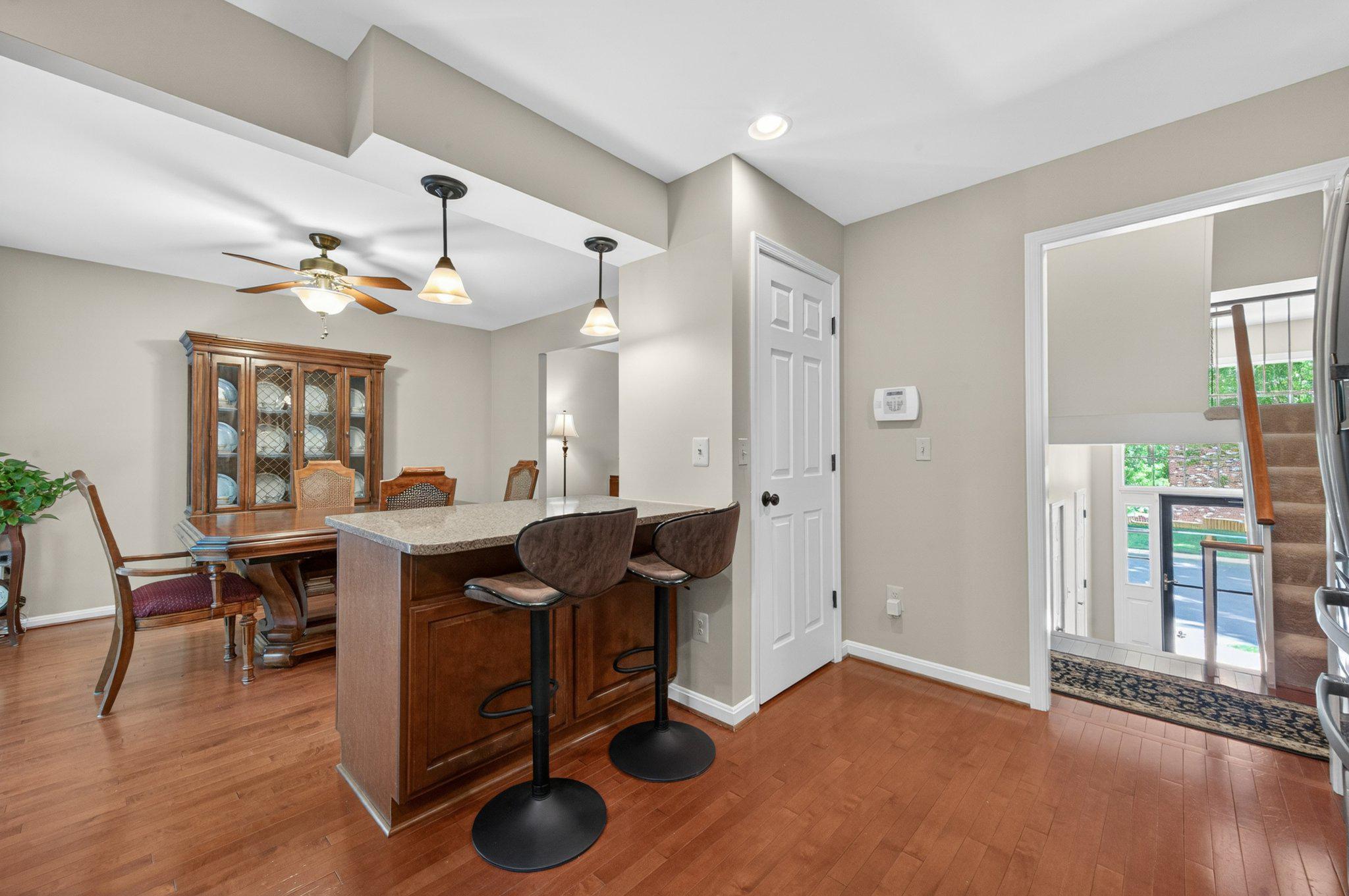 11737 Dry River Court Reston, VA 20191 - Photo 9 of 45 a view of a workspace with furniture and a livingroom
