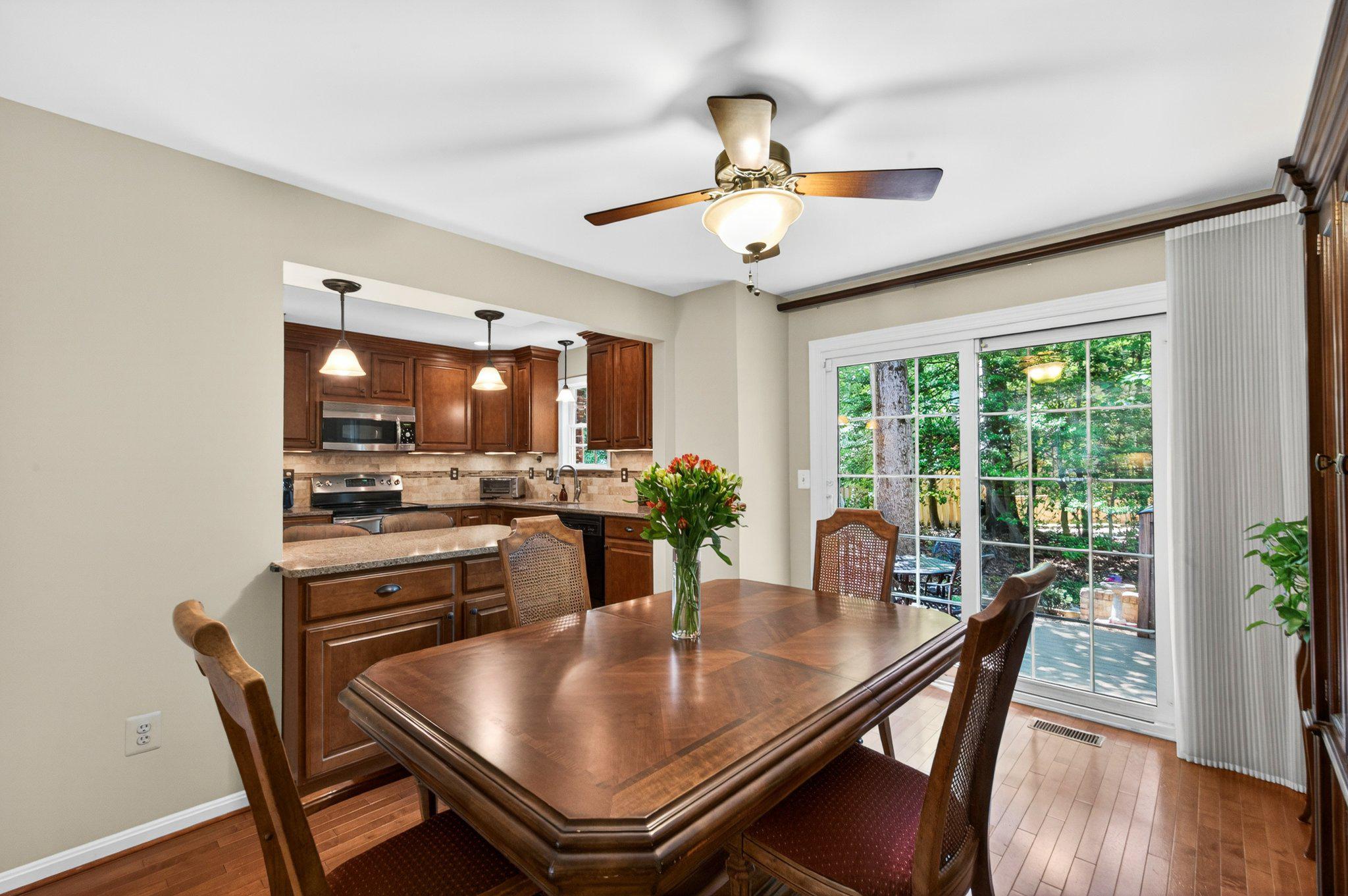 11737 Dry River Court Reston, VA 20191 - Photo 10 of 45 a view of a dining room with furniture window and wooden floor