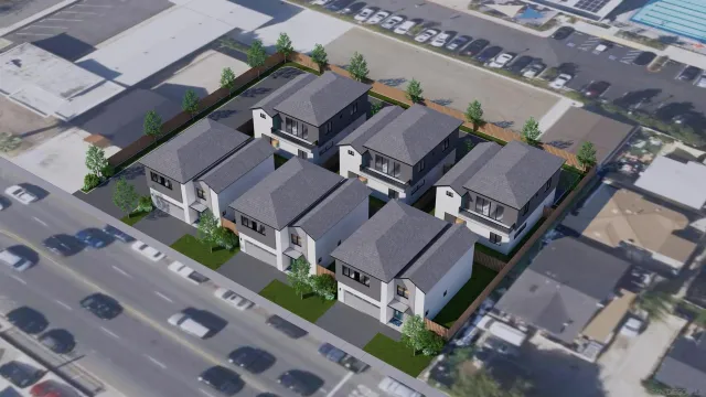 an aerial view of a residential apartment building with a yard