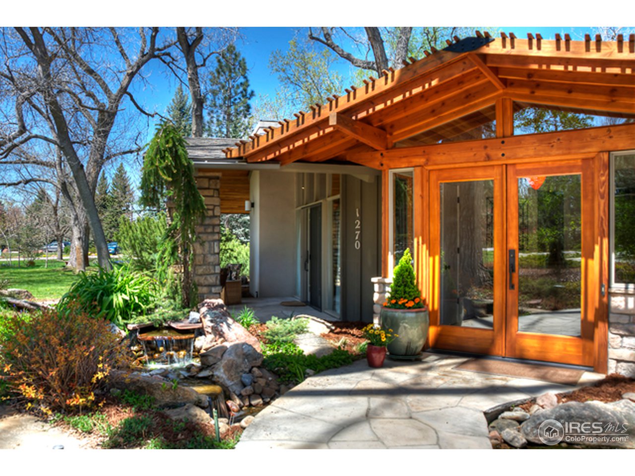 1270 Old Tale Road Boulder, CO 80303 - Photo 1 of 25 a front view of a house with garden