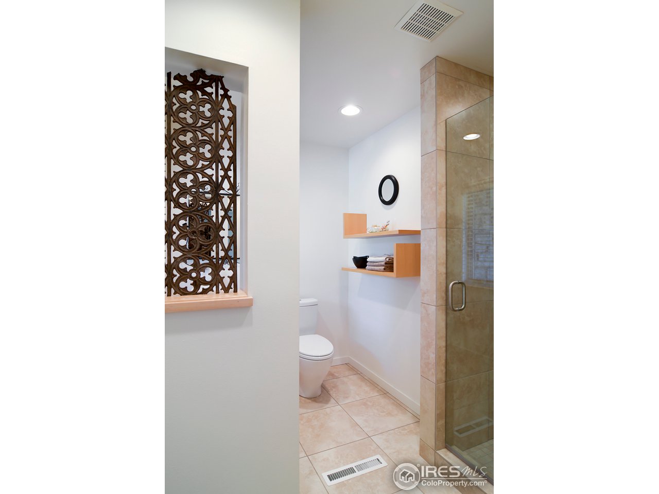 1270 Old Tale Road Boulder, CO 80303 - Photo 16 of 25 a bathroom with a toilet and a shower curtain