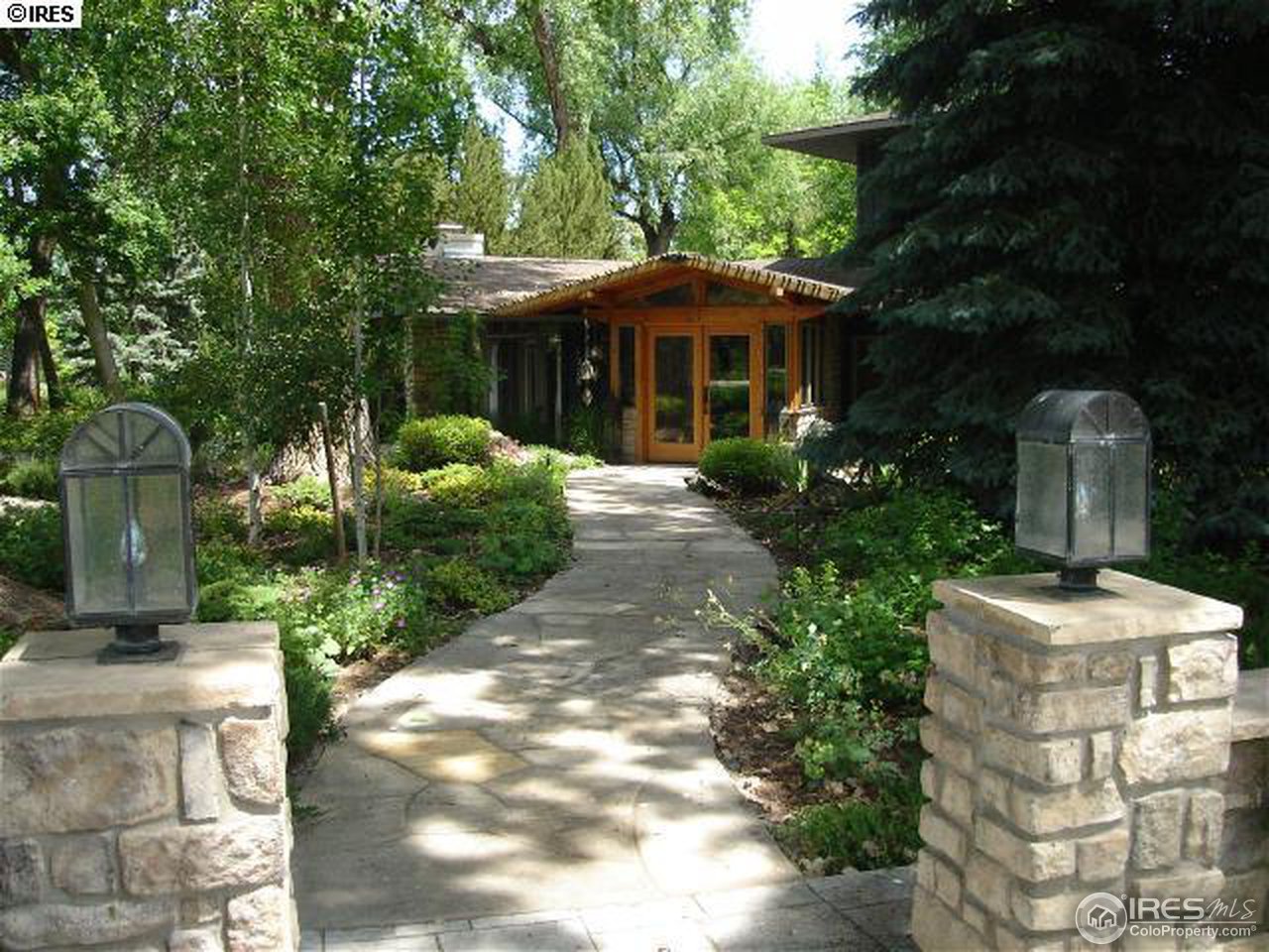 1270 Old Tale Road Boulder, CO 80303 - Photo 2 of 25 a front view of a house with garden