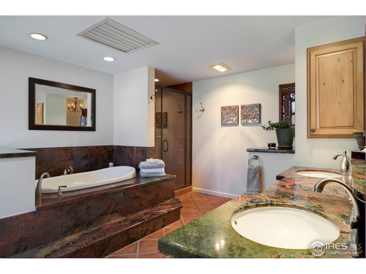 1270 Old Tale Road Boulder, CO 80303 - Photo 23 of 25 a en suite bathroom with a toilet sink and mirror