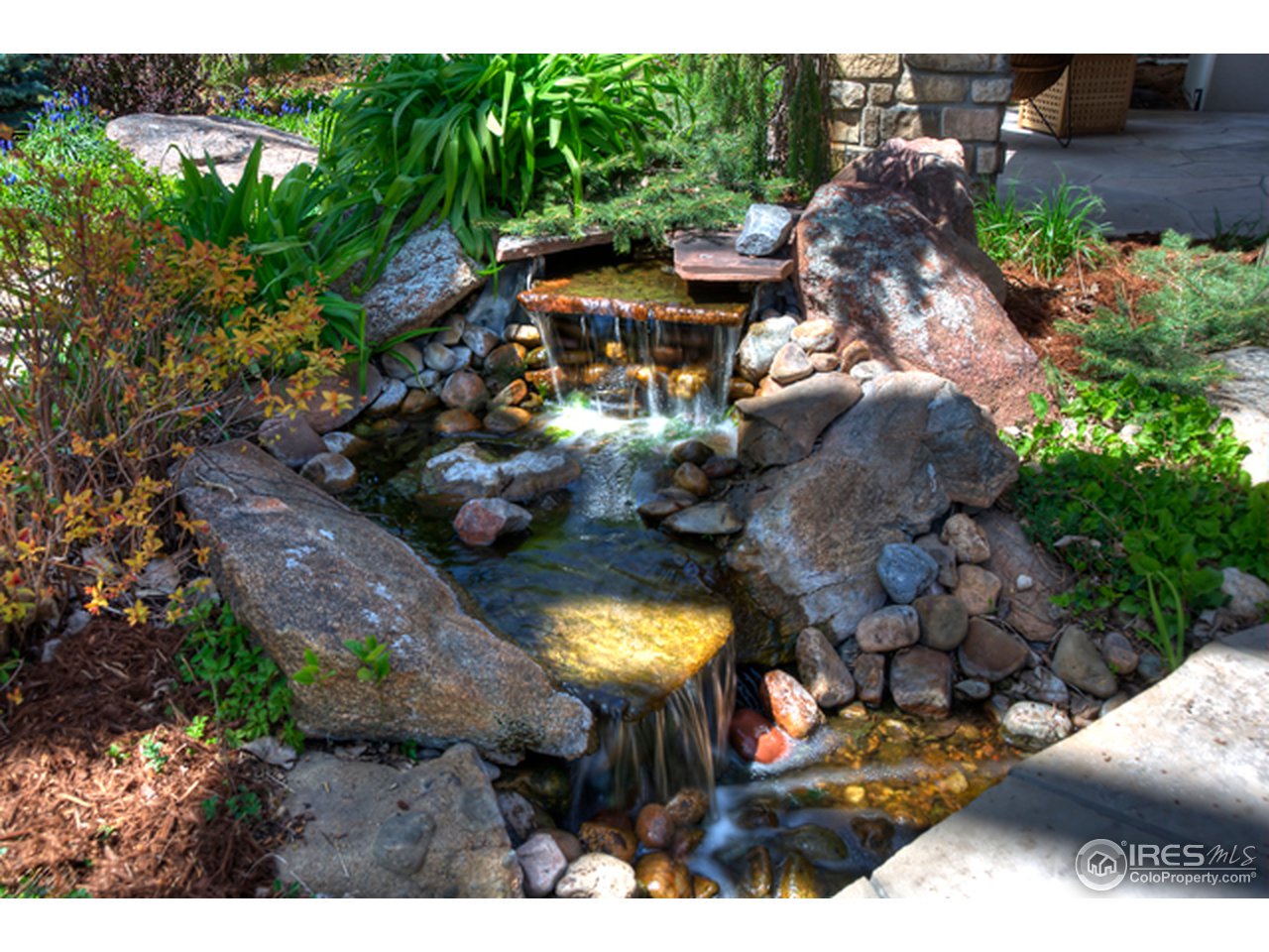 1270 Old Tale Road Boulder, CO 80303 - Photo 4 of 25 a view of a swimming pool with lawn chairs and a fire pit