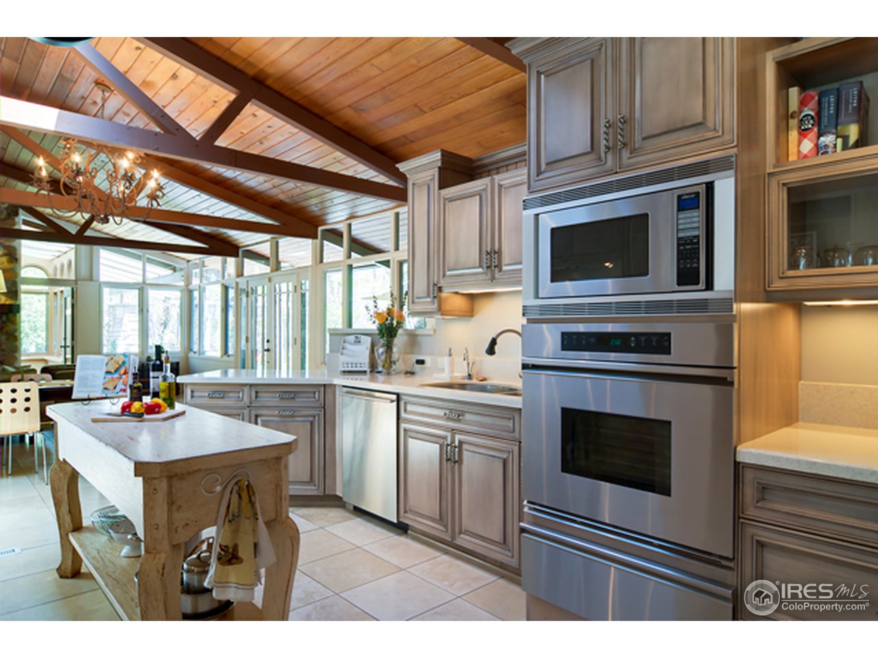 1270 Old Tale Road Boulder, CO 80303 - Photo 9 of 25 a kitchen with a stove a microwave and cabinets